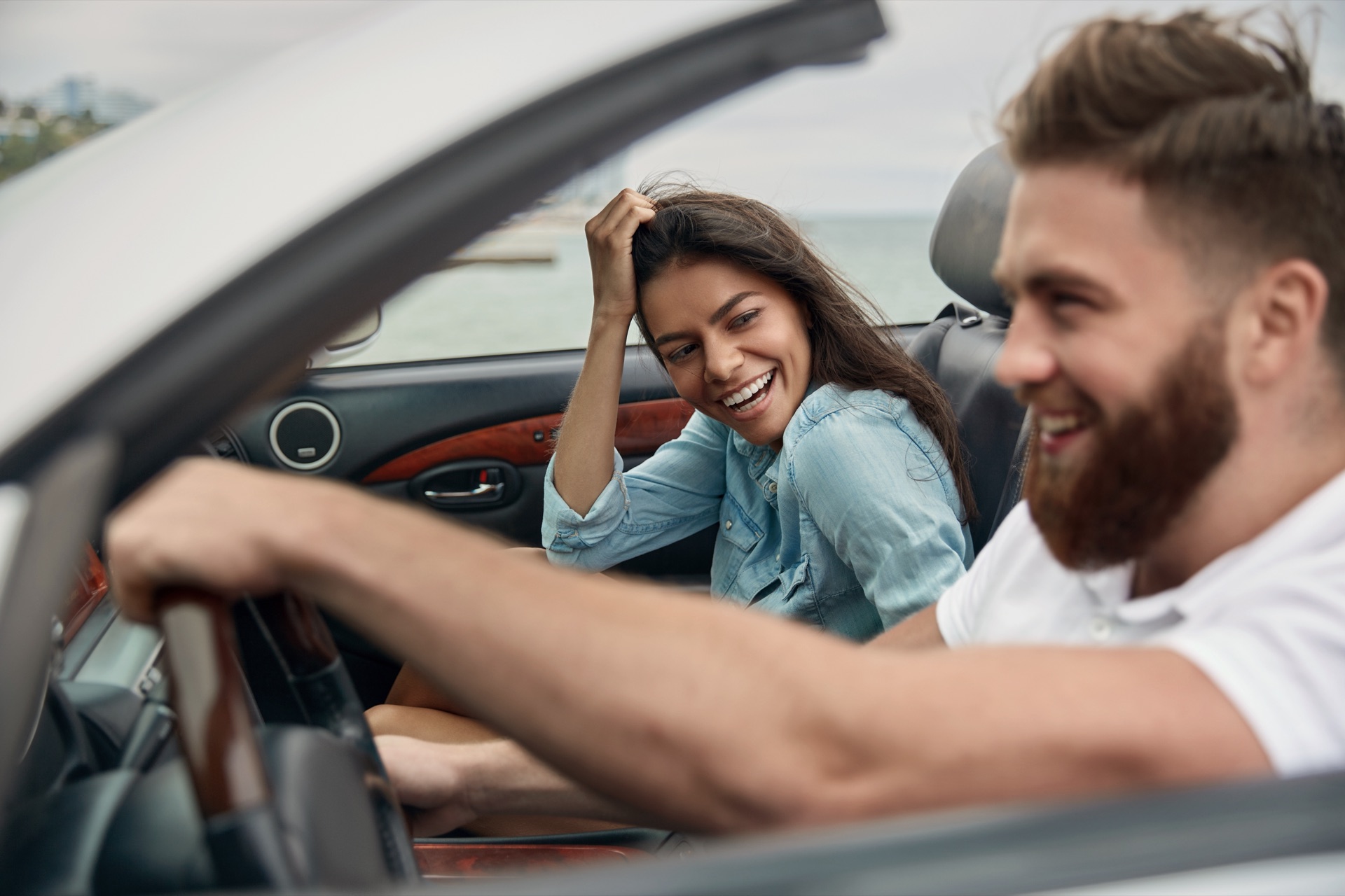 Happy couple enjoying a clean car